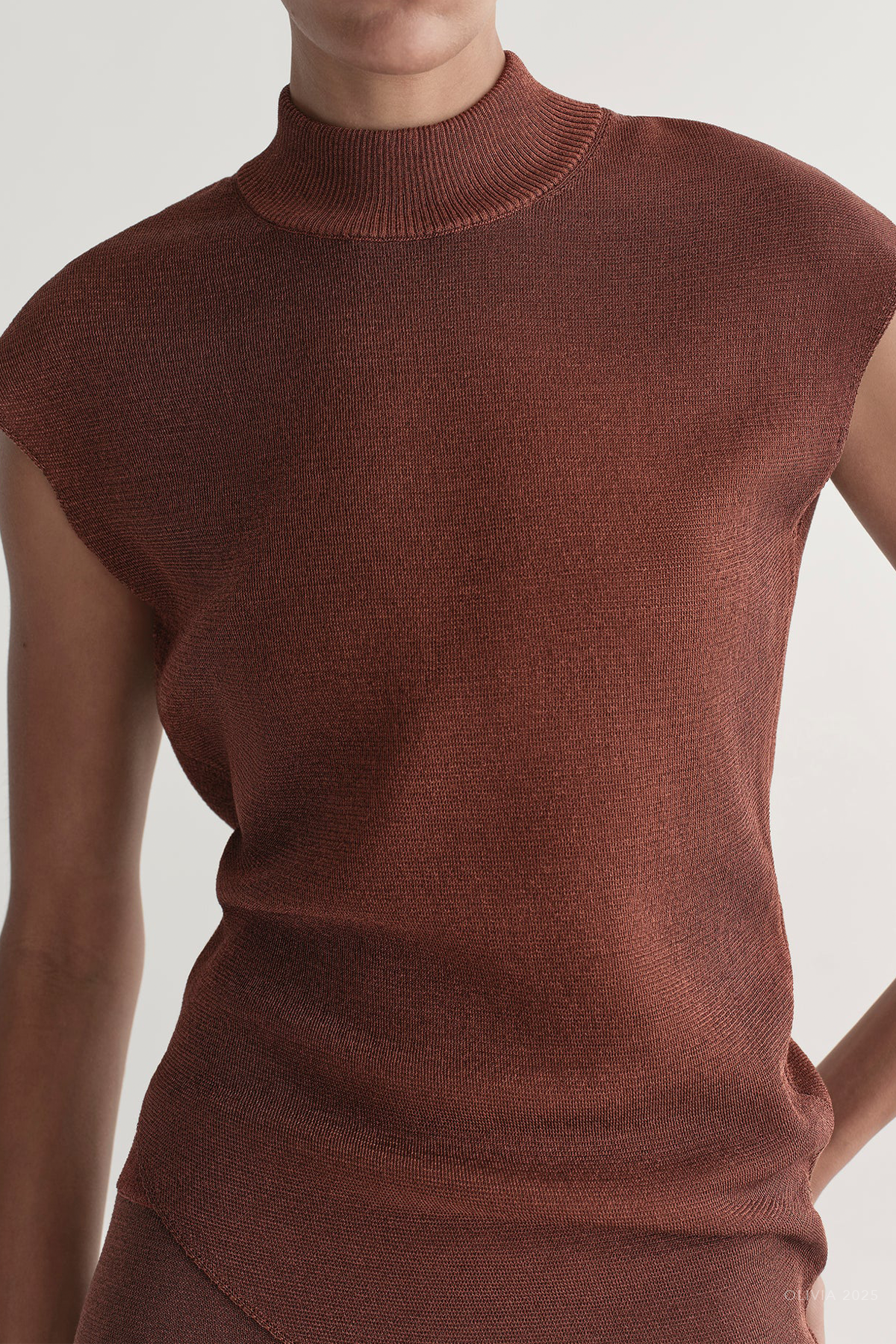Edith Metallic Knit Asymmetric Top in Rust